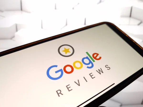 Smartphone displaying Google Reviews logo